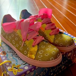 Cute gold sneakers with pink silk laces